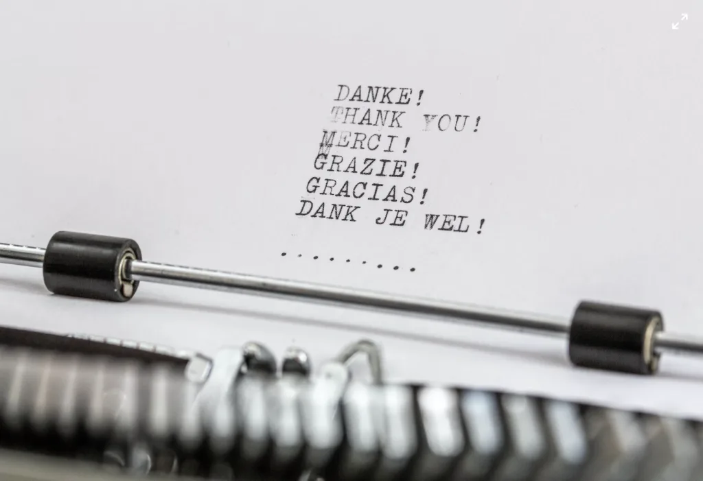 Expressing Gratitude in Mentoring 5 Paper in a typewriter that has the words thank you typed in different languages
